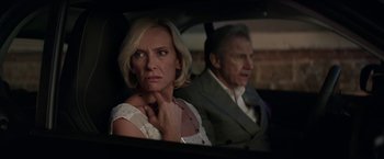 Movie still from “Madame” (2017), directed by Amanda Sthers – An older man and a younger woman sitting in a car; Close Up shot, Over the shoulder angle