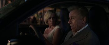 Movie still from “Madame” (2017), directed by Amanda Sthers – An older man and a younger woman in a car at night; Close Up shot, Over the shoulder angle