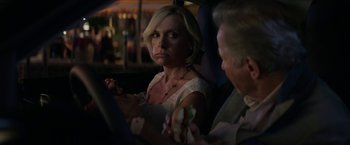 Movie still from “Madame” (2017), directed by Amanda Sthers – A woman sitting next to a man in a car; Close Up shot, Over the shoulder angle