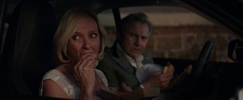 Movie still from “Madame” (2017), directed by Amanda Sthers – A man and a woman sitting in the back of a car; Medium shot, Over the shoulder angle