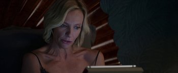 Movie still from “Madame” (2017), directed by Amanda Sthers – A woman sitting in front of a laptop computer; Close Up shot, Overhead angle