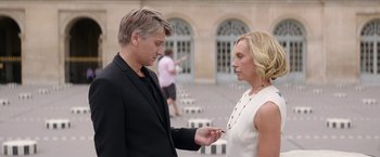 Movie still from “Madame” (2017), directed by Amanda Sthers – A man and a woman holding hands in front of a building; Medium shot, Over the shoulder angle