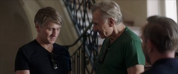 Movie still from “Madame” (2017), directed by Amanda Sthers – A man and a boy talking to each other; Medium shot, Over the shoulder angle