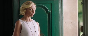 Movie still from “Madame” (2017), directed by Amanda Sthers – A woman wearing a white dress and a necklace; Close Up shot, Low angle