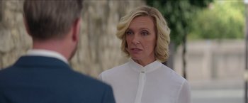 Movie still from “Madame” (2017), directed by Amanda Sthers – A woman in a white shirt is talking to a man in a blue suit; Close Up shot, Over the shoulder angle