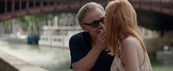 Movie still from “Madame” (2017), directed by Amanda Sthers – An older woman putting lipstick on a younger woman's face; Close Up shot, Over the shoulder angle