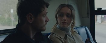 Movie still from “Little Fish” (2020), directed by Chad Hartigan – A man and a woman sitting next to each other on a train; Close Up shot, Over the shoulder angle