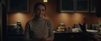 Movie still from “Little Fish” (2020), directed by Chad Hartigan – A woman sitting in front of a coffee mug; Medium shot, Over the shoulder angle