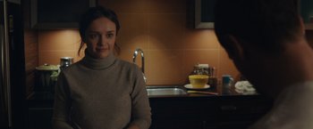 Movie still from “Little Fish” (2020), directed by Chad Hartigan – A woman standing in front of a kitchen sink; Medium shot, Over the shoulder angle