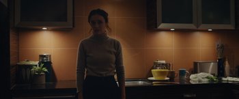 Movie still from “Little Fish” (2020), directed by Chad Hartigan – A woman standing in front of a sink in a kitchen; Medium shot, Low angle