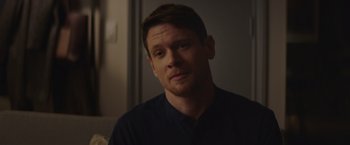 Movie still from “Little Fish” (2020), directed by Chad Hartigan – A person sitting in front of a window; Close Up shot, Over the shoulder angle