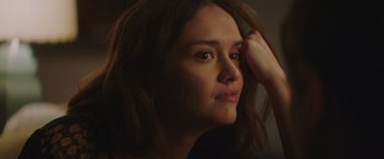 Movie still from “Little Fish” (2020), directed by Chad Hartigan – A person with long brown hair; Close Up shot, Over the shoulder angle