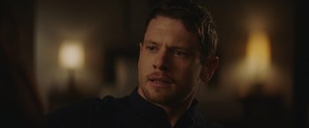 Movie still from “Little Fish” (2020), directed by Chad Hartigan – A person wearing a black shirt; Close Up shot, Over the shoulder angle