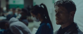 Movie still from “Little Fish” (2020), directed by Chad Hartigan – A group of people sitting in a room; Close Up shot, Over the shoulder angle