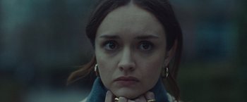 Movie still from “Little Fish” (2020), directed by Chad Hartigan – A person with her hand on her chin; Close Up shot, Low angle