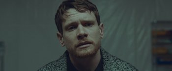 Movie still from “Little Fish” (2020), directed by Chad Hartigan – A person wearing a jacket; Close Up shot, Low angle