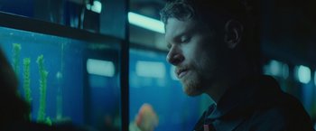 Movie still from “Little Fish” (2020), directed by Chad Hartigan – A person with his eyes closed; Close Up shot, Low angle