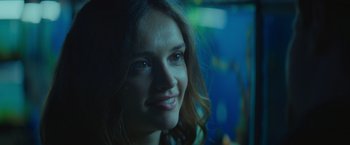 Movie still from “Little Fish” (2020), directed by Chad Hartigan – A woman smiling for the camera; Close Up shot, Over the shoulder angle