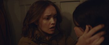 Movie still from “Little Fish” (2020), directed by Chad Hartigan – A young woman looking at a young man in a bathroom; Close Up shot, Over the shoulder angle