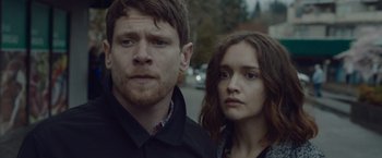 Movie still from “Little Fish” (2020), directed by Chad Hartigan – A man and a woman standing next to each other on the street; Close Up shot, Over the shoulder angle