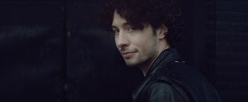 Movie still from “Little Fish” (2020), directed by Chad Hartigan – A person wearing a leather jacket; Close Up shot, Low angle