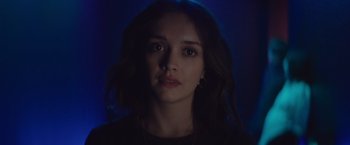 Movie still from “Little Fish” (2020), directed by Chad Hartigan – A young woman with long brown hair is looking at the camera; Close Up shot, Low angle