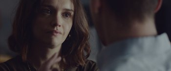 Movie still from “Little Fish” (2020), directed by Chad Hartigan – A person looking at the camera; Close Up shot, Over the shoulder angle