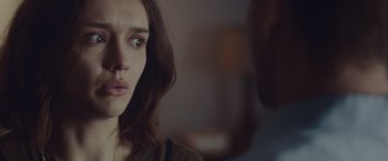 Movie still from “Little Fish” (2020), directed by Chad Hartigan – A person looking at the camera; Close Up shot, Over the shoulder angle