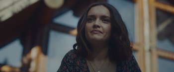 Movie still from “Little Fish” (2020), directed by Chad Hartigan – A person wearing a necklace; Close Up shot, Over the shoulder angle