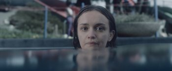 Movie still from “Little Fish” (2020), directed by Chad Hartigan – A woman is looking out of a car window; Close Up shot, Over the shoulder angle