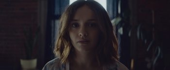 Movie still from “Little Fish” (2020), directed by Chad Hartigan – A person wearing a shirt; Close Up shot, Over the shoulder angle