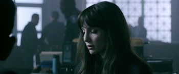 Movie still from “Malignant” (2021), directed by James Wan – A person with long dark hair; Close Up shot, Over the shoulder angle