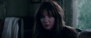 Movie still from “Malignant” (2021), directed by James Wan – A person with long hair; Close Up shot, Over the shoulder angle