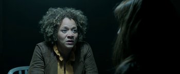 Movie still from “Malignant” (2021), directed by James Wan – An older woman is talking to a younger woman; Close Up shot, Over the shoulder angle