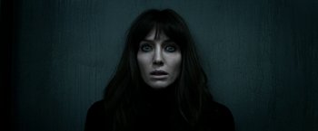 Movie still from “Malignant” (2021), directed by James Wan – A person with long black hair; Close Up shot, Overhead angle