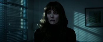 Movie still from “Malignant” (2021), directed by James Wan – A woman with long hair is looking at the camera; Close Up shot, Low angle