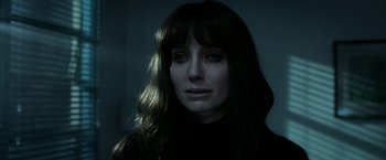 Movie still from “Malignant” (2021), directed by James Wan – A person with long hair; Close Up shot, Over the shoulder angle