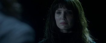 Movie still from “Malignant” (2021), directed by James Wan – A person with long black hair; Close Up shot, Over the shoulder angle