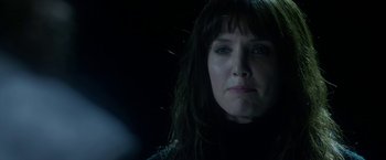 Movie still from “Malignant” (2021), directed by James Wan – A person with long hair; Close Up shot, Over the shoulder angle