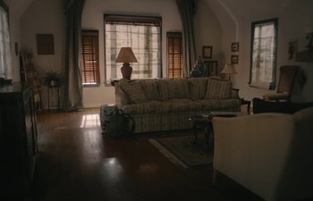 Movie still from “Marcel the Shell with Shoes On” (2021), directed by Dean Fleischer Camp – A living room filled with furniture next to a window; Extreme Wide shot, High angle
