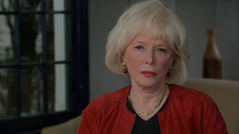 Movie still from “Marcel the Shell with Shoes On” (2021), directed by Dean Fleischer Camp – An older woman with blonde hair wearing a red jacket; Close Up shot, Over the shoulder angle