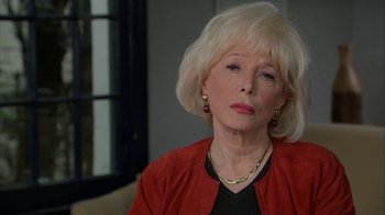 Movie still from “Marcel the Shell with Shoes On” (2021), directed by Dean Fleischer Camp – An older woman with blonde hair wearing a red jacket; Close Up shot, Over the shoulder angle