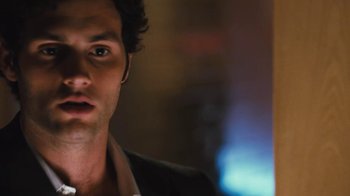 Movie still from “Margin Call” (2011), directed by J.C. Chandor – A man's face in front of a blurry background; Close Up shot, Over the shoulder angle