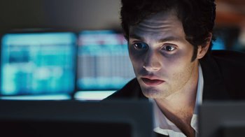 Movie still from “Margin Call” (2011), directed by J.C. Chandor – A person using a computer at night; Close Up shot, Over the shoulder angle