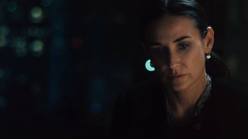 Movie still from “Margin Call” (2011), directed by J.C. Chandor – A person wearing a black shirt; Close Up shot, Over the shoulder angle