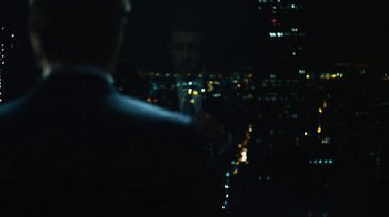 Movie still from “Margin Call” (2011), directed by J.C. Chandor – A man standing in front of a window at night; Medium shot, Over the shoulder angle