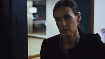 Movie still from “Margin Call” (2011), directed by J.C. Chandor – A person wearing a jacket; Close Up shot, Over the shoulder angle