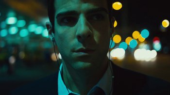 Movie still from “Margin Call” (2011), directed by J.C. Chandor – A person wearing ear phones; Close Up shot, Low angle
