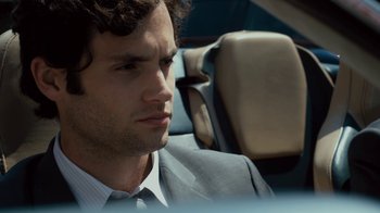 Movie still from “Margin Call” (2011), directed by J.C. Chandor – A person wearing a suit and tie; Close Up shot, Over the shoulder angle
