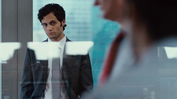 Movie still from “Margin Call” (2011), directed by J.C. Chandor – A man standing in front of another man in front of a mirror; Close Up shot, Over the shoulder angle